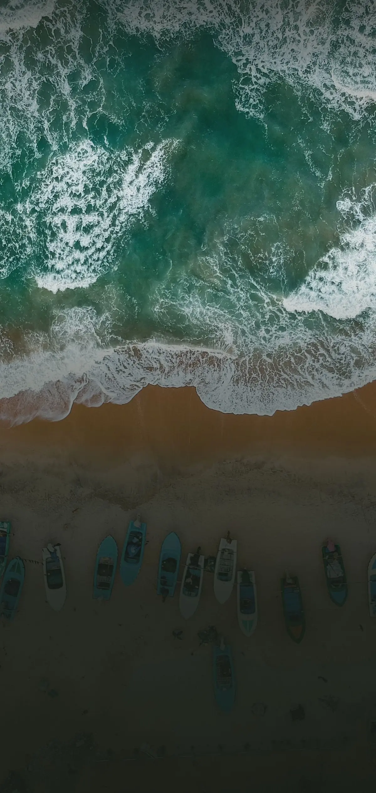 Aerial view of waves breaking on a Sri Lankan beach
